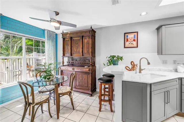 a view of a kitchen and dining area with furniture