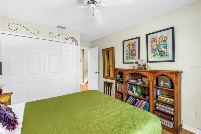 a backyard of a house with a large tree