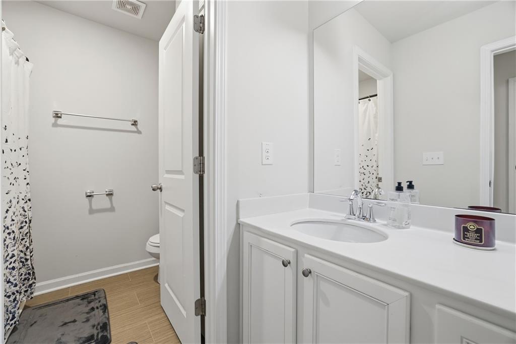 175 Paxton Lane Jefferson, GA 30549 - Photo 30 of 39 a bathroom with a sink a toilet and shower