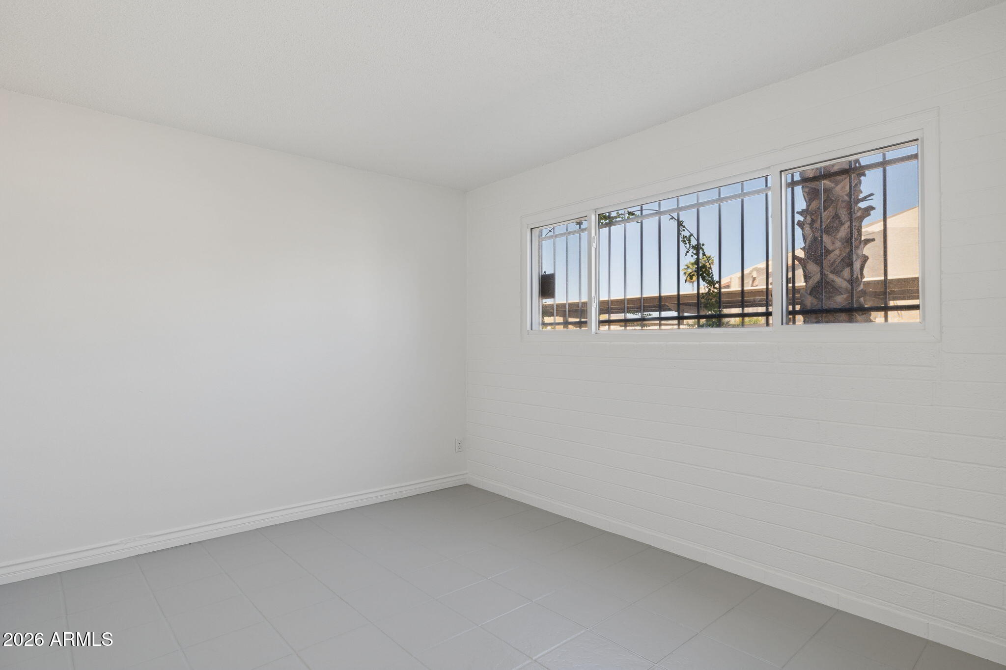825 North Hayden Road, Unit C104 Scottsdale, AZ 85257 - Photo 11 of 33 a view of an empty room with a window
