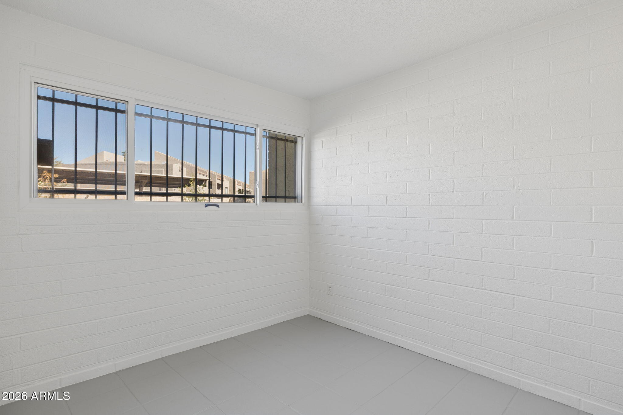825 North Hayden Road, Unit C104 Scottsdale, AZ 85257 - Photo 13 of 33 a view of a room with wooden floor