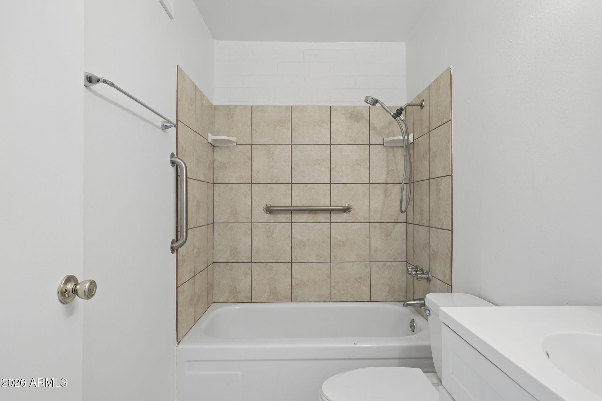 825 North Hayden Road, Unit C104 Scottsdale, AZ 85257 - Photo 15 of 33 a bathroom with a bathtub and shower