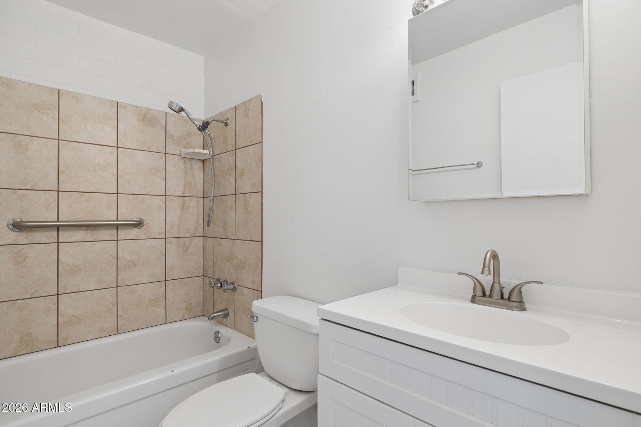 825 North Hayden Road, Unit C104 Scottsdale, AZ 85257 - Photo 16 of 33 a bathroom with a sink toilet and bathtub