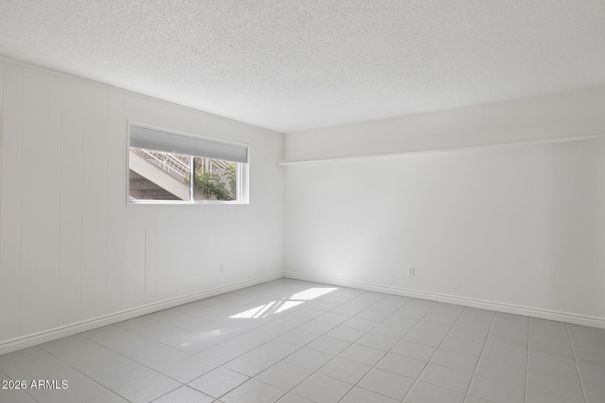 825 North Hayden Road, Unit C104 Scottsdale, AZ 85257 - Photo 4 of 33 an empty room with windows