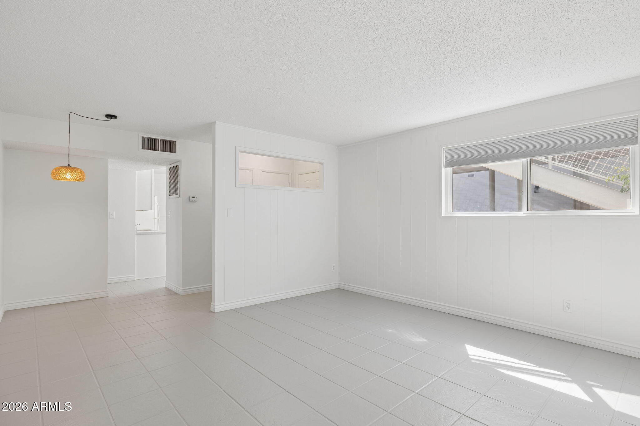 825 North Hayden Road, Unit C104 Scottsdale, AZ 85257 - Photo 5 of 33 an empty room with windows