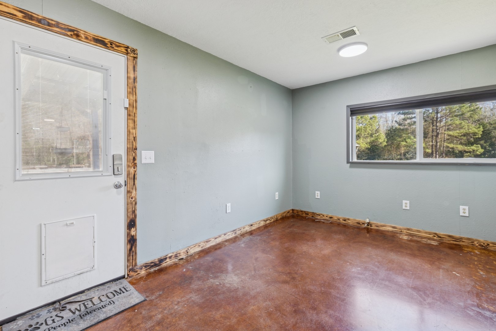 392 Robert E Lee Road Livingston, TX 77351 - Photo 14 of 43 an empty room with windows