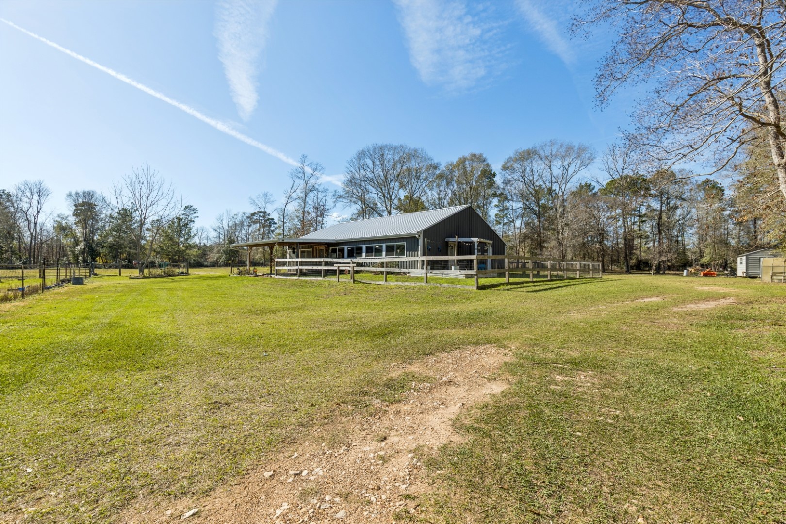 392 Robert E Lee Road Livingston, TX 77351 - Photo 2 of 43 a view of a swimming pool with an outdoor space and seating area