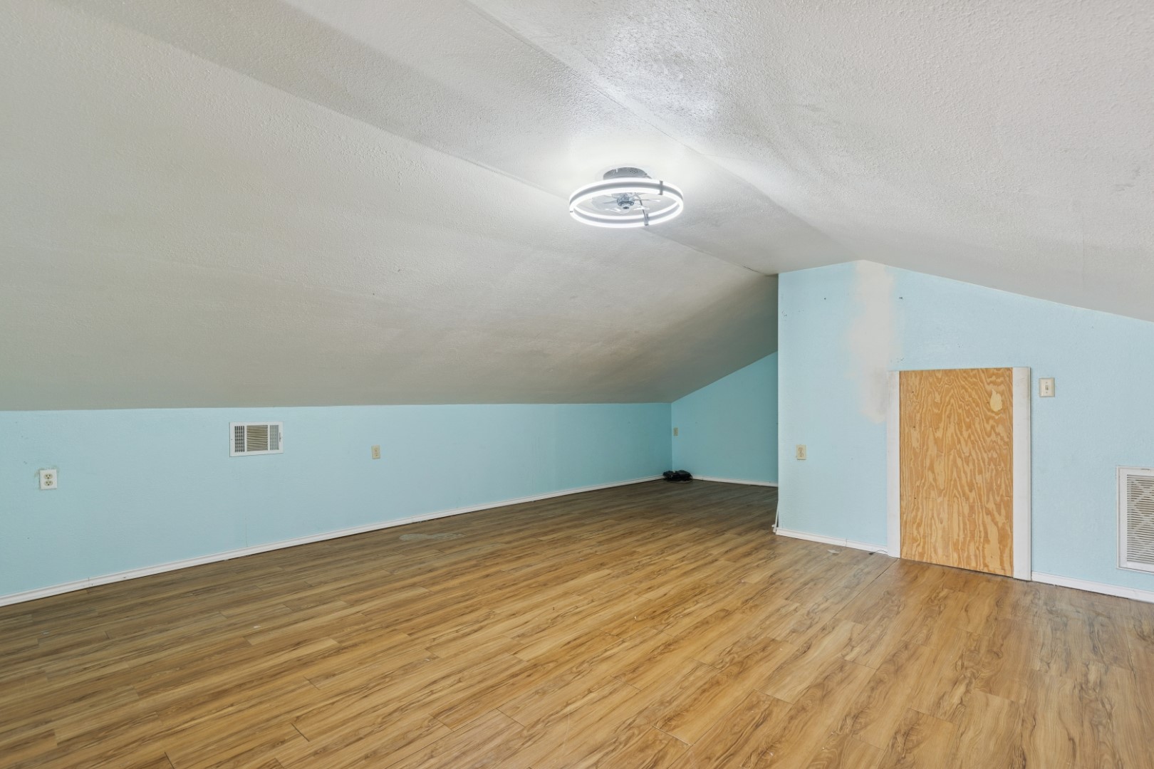 392 Robert E Lee Road Livingston, TX 77351 - Photo 26 of 43 an empty room with wooden floor and windows