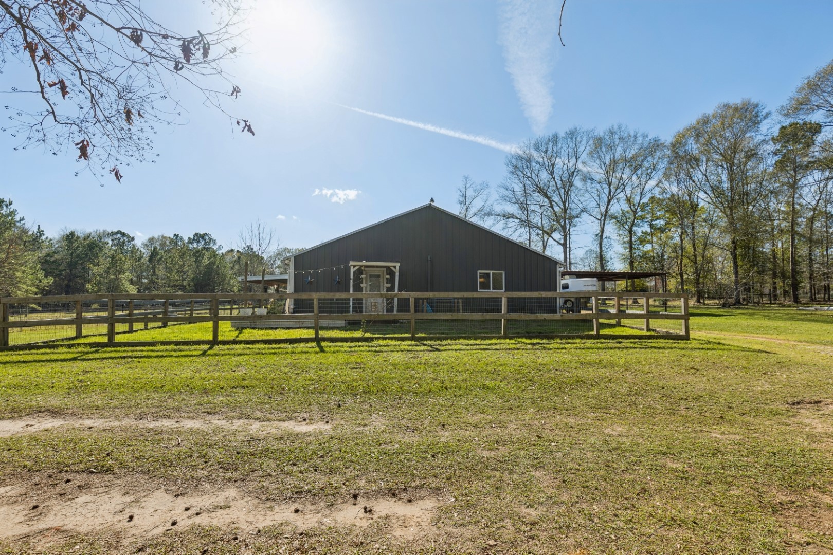 392 Robert E Lee Road Livingston, TX 77351 - Photo 28 of 43 a view of a house with a big yard