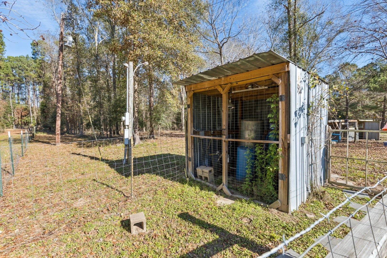 392 Robert E Lee Road Livingston, TX 77351 - Photo 35 of 43 a view of a backyard with wooden fence