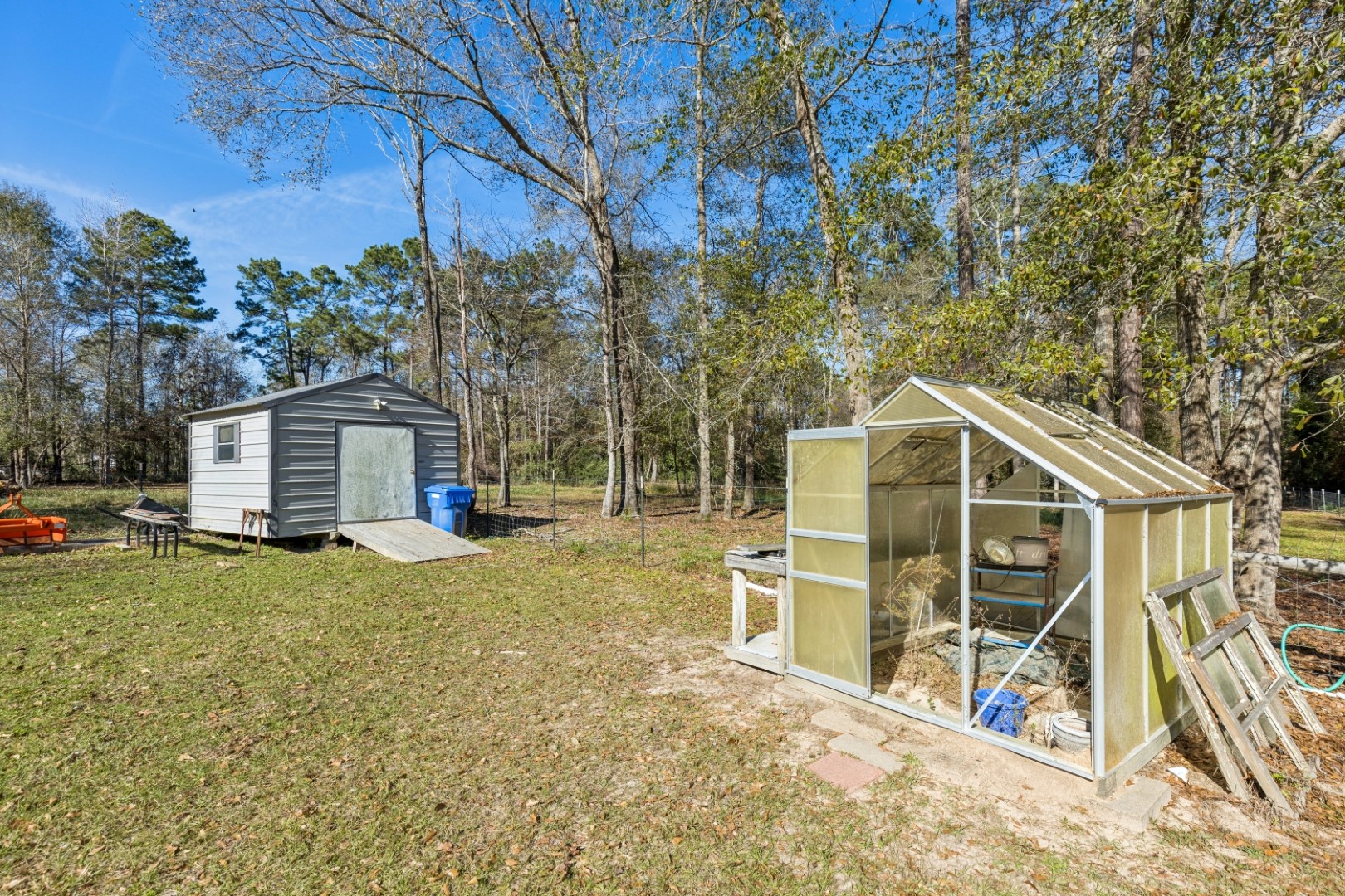 392 Robert E Lee Road Livingston, TX 77351 - Photo 36 of 43 a view of a house with backyard and sitting area