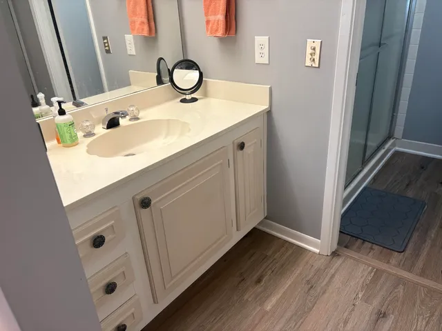 a bathroom with a sink and a mirror