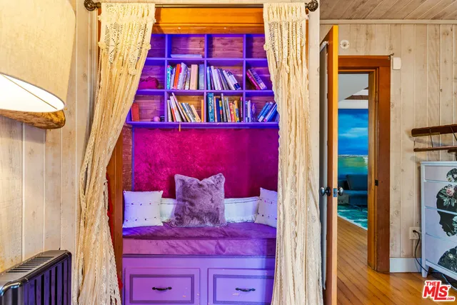 a living room with furniture lamp and window