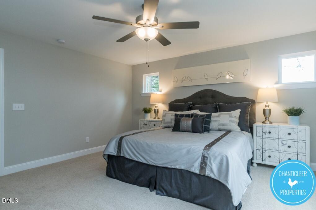 2528 Reynolds Drive Graham, NC 27253 - Photo 12 of 21 a bedroom with a bed and a chandelier