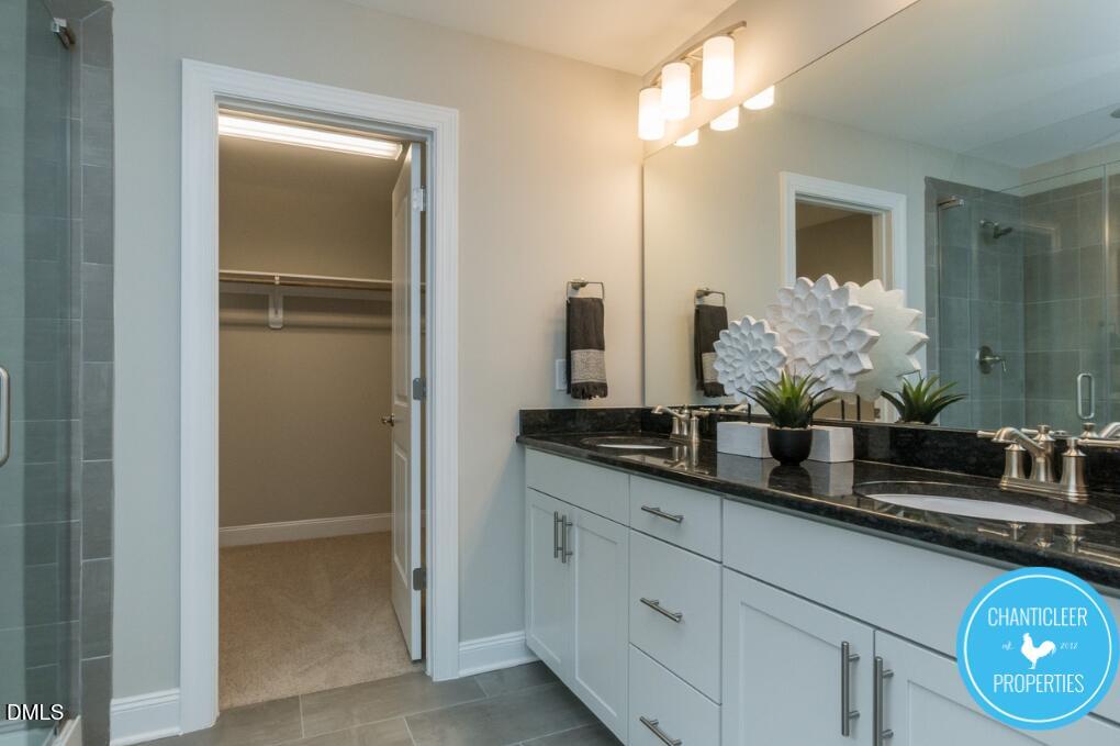 2528 Reynolds Drive Graham, NC 27253 - Photo 14 of 21 a bathroom with a granite countertop sink and a mirror