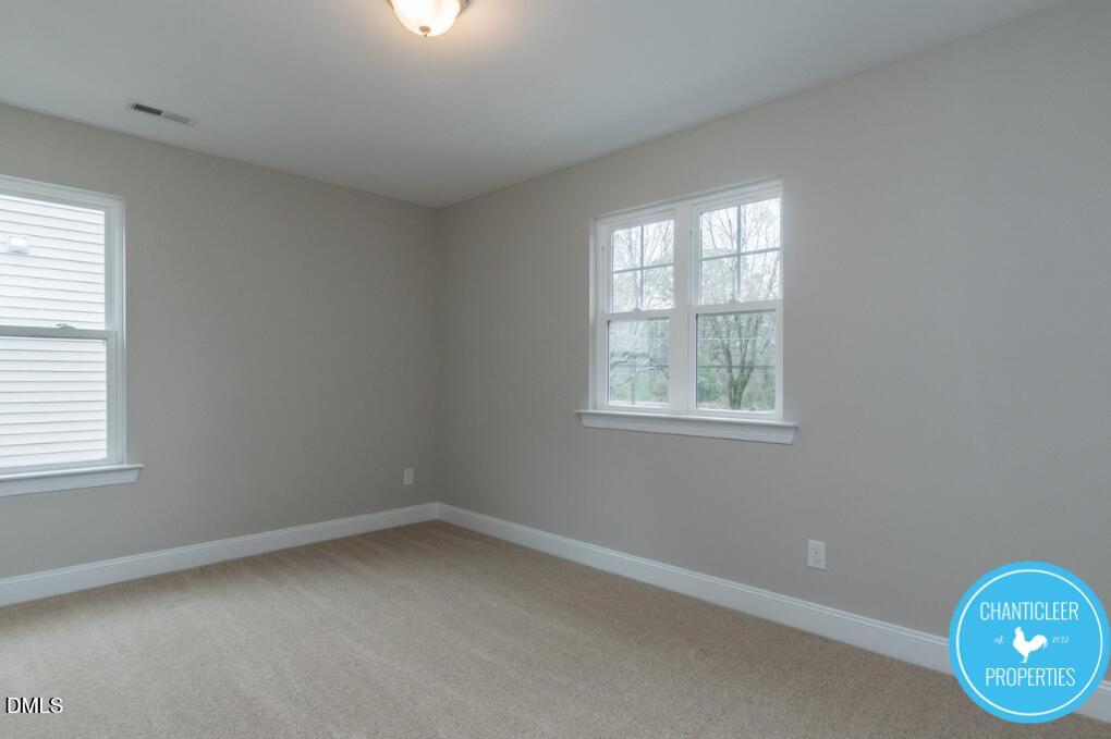 2528 Reynolds Drive Graham, NC 27253 - Photo 17 of 21 an empty room with windows