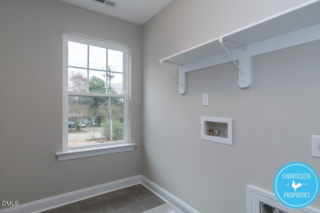2528 Reynolds Drive Graham, NC 27253 - Photo 18 of 21 an empty room with wooden floor and windows
