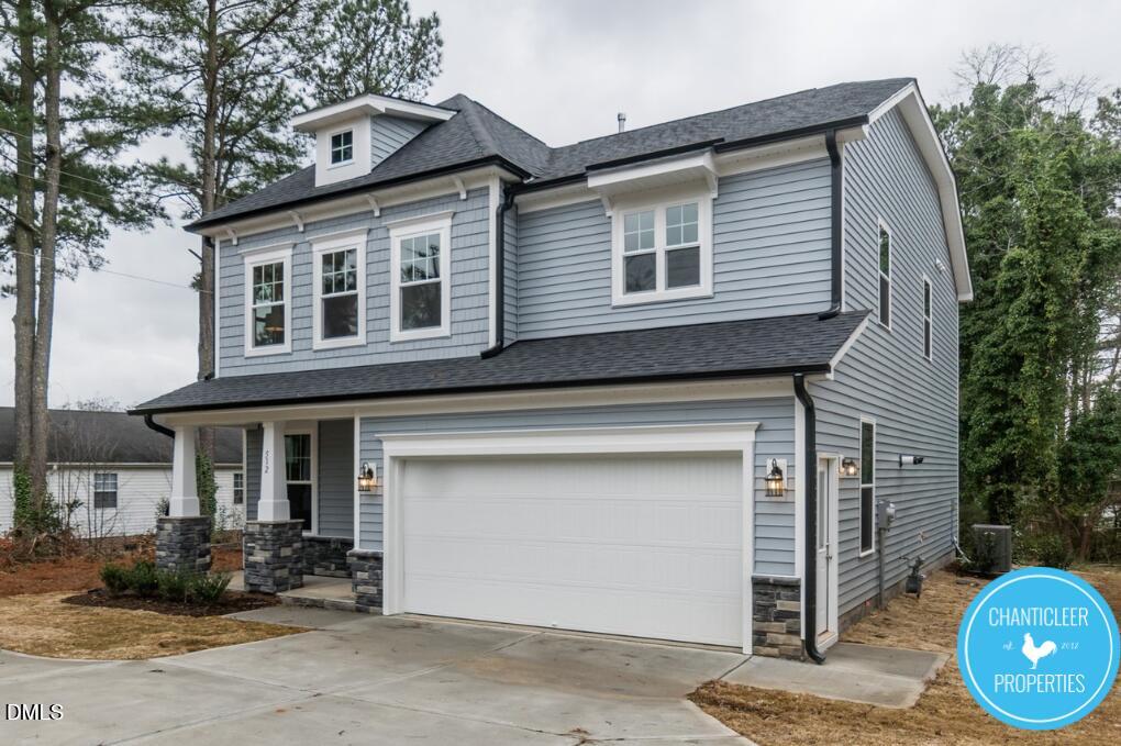 2528 Reynolds Drive Graham, NC 27253 - Photo 20 of 21 a front view of a house with garden