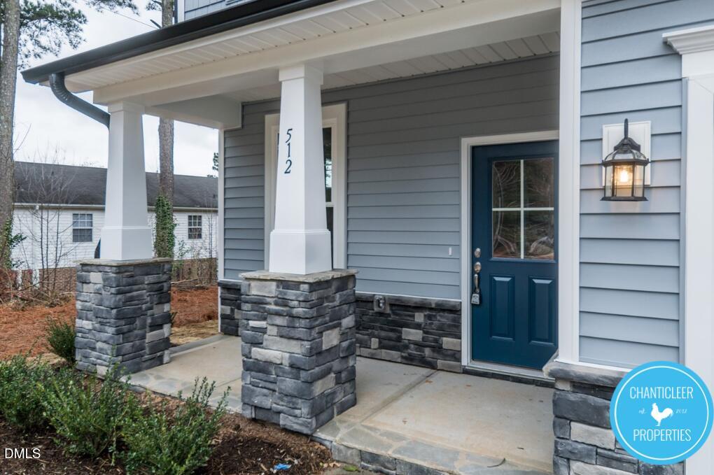 2528 Reynolds Drive Graham, NC 27253 - Photo 2 of 21 a front view of a house with a garden