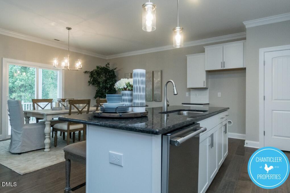 2528 Reynolds Drive Graham, NC 27253 - Photo 6 of 21 a kitchen with granite countertop a sink cabinets and window