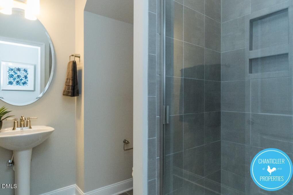 2528 Reynolds Drive Graham, NC 27253 - Photo 10 of 21 a bathroom with a sink toilet and shower