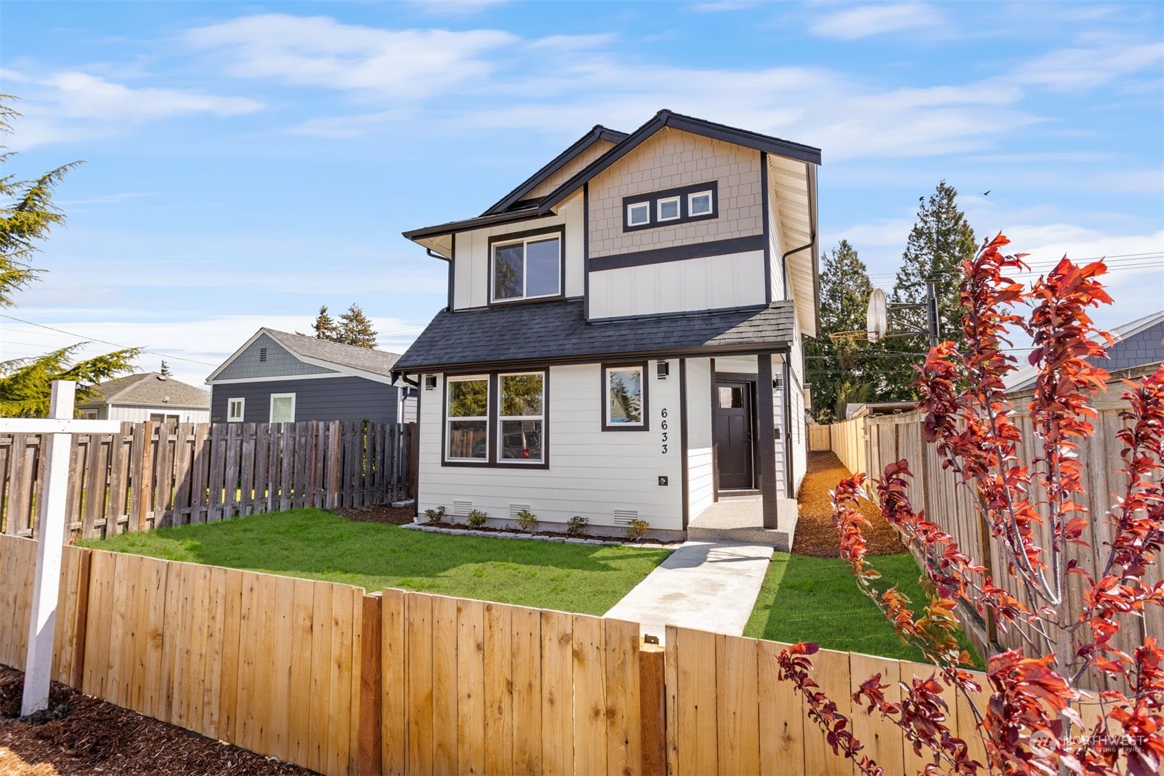 6633 South Pine Street Tacoma, WA 98409 - Photo 1 of 23 a front view of a house with a yard