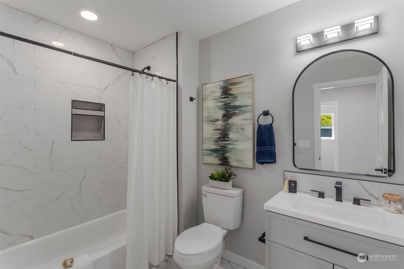 6633 South Pine Street Tacoma, WA 98409 - Photo 15 of 23 a bathroom with a toilet sink vanity tub and shower