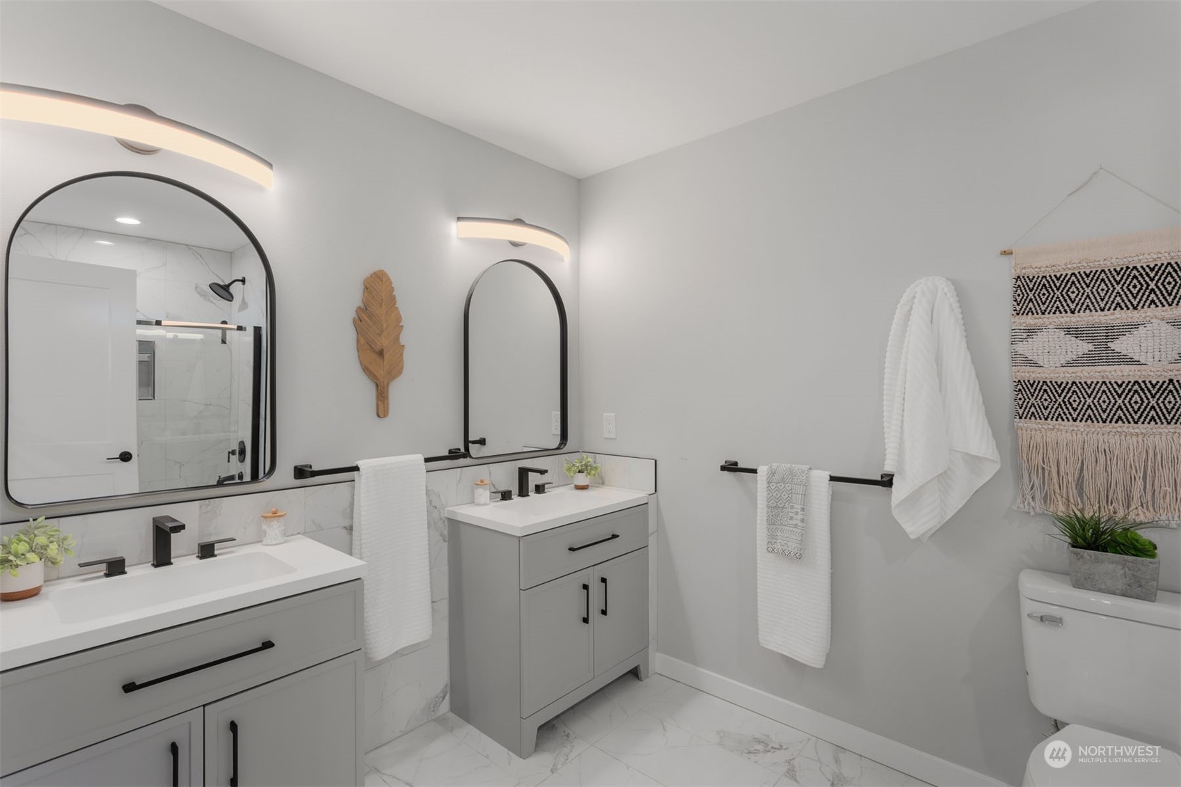 6633 South Pine Street Tacoma, WA 98409 - Photo 16 of 23 a spacious bathroom with double vanity a toilet a mirror a vanity and bathtub