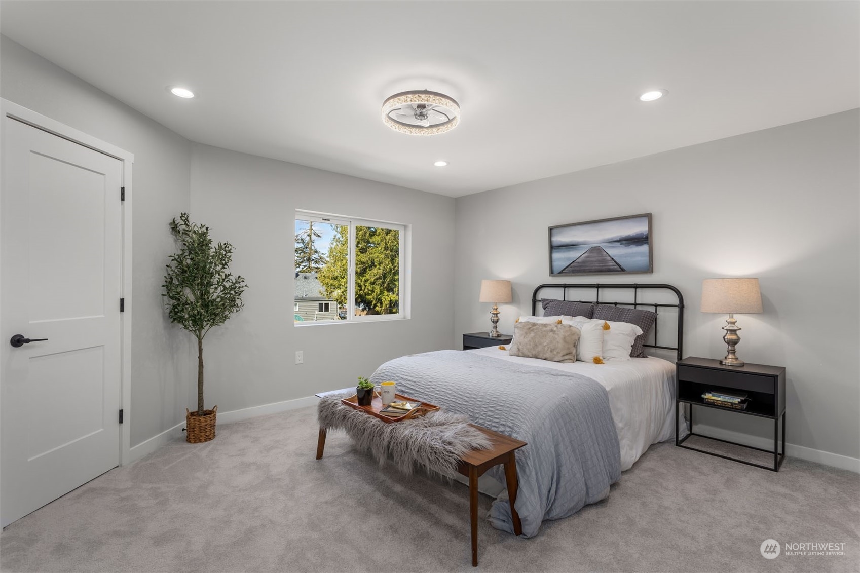 6633 South Pine Street Tacoma, WA 98409 - Photo 19 of 23 a bedroom with a bed and a potted plant