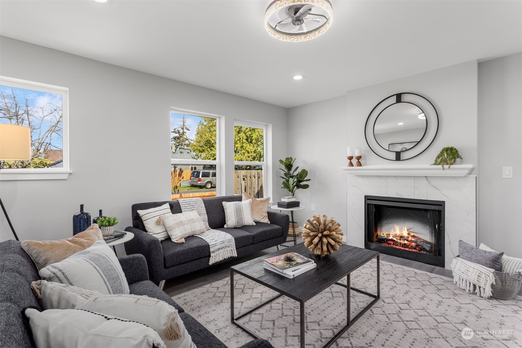 6633 South Pine Street Tacoma, WA 98409 - Photo 2 of 23 a living room with furniture and a fireplace