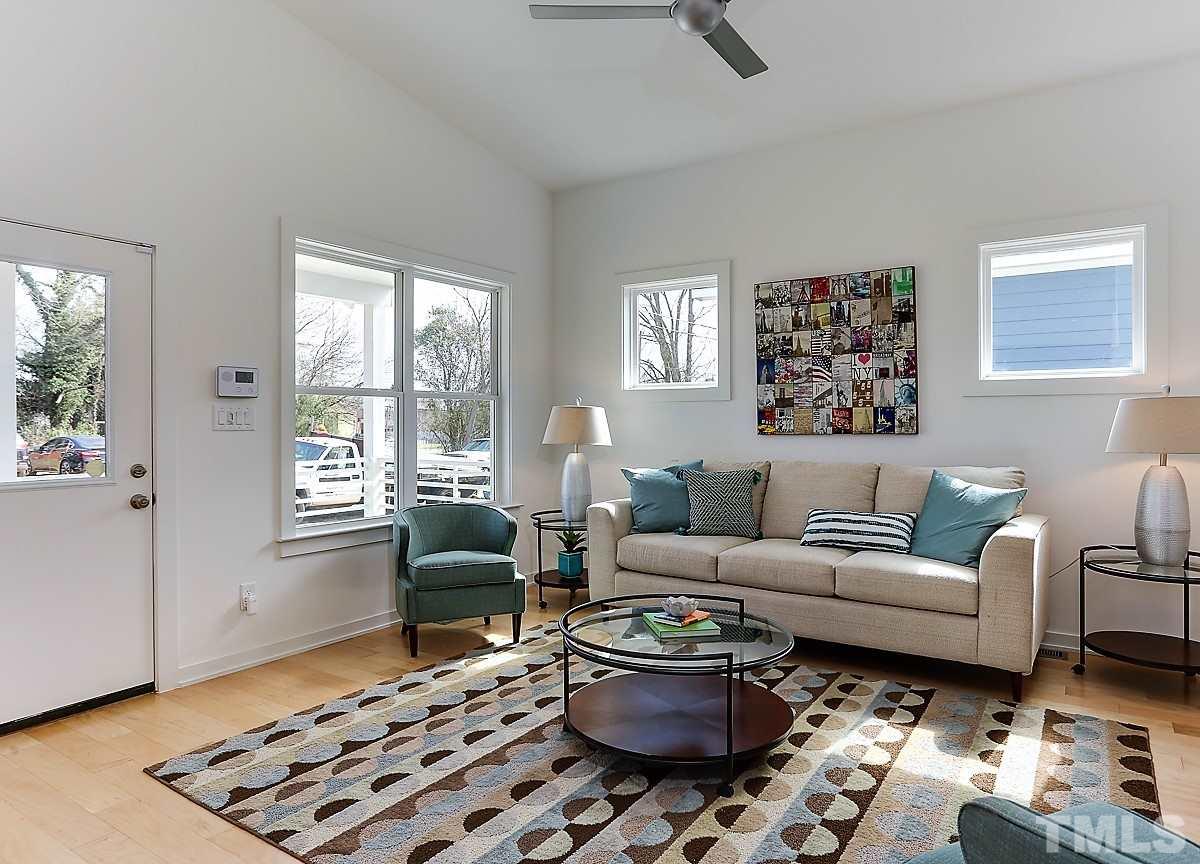 1310 South East Street Raleigh, NC 27601 - Photo 12 of 21 a living room with furniture a rug and a window