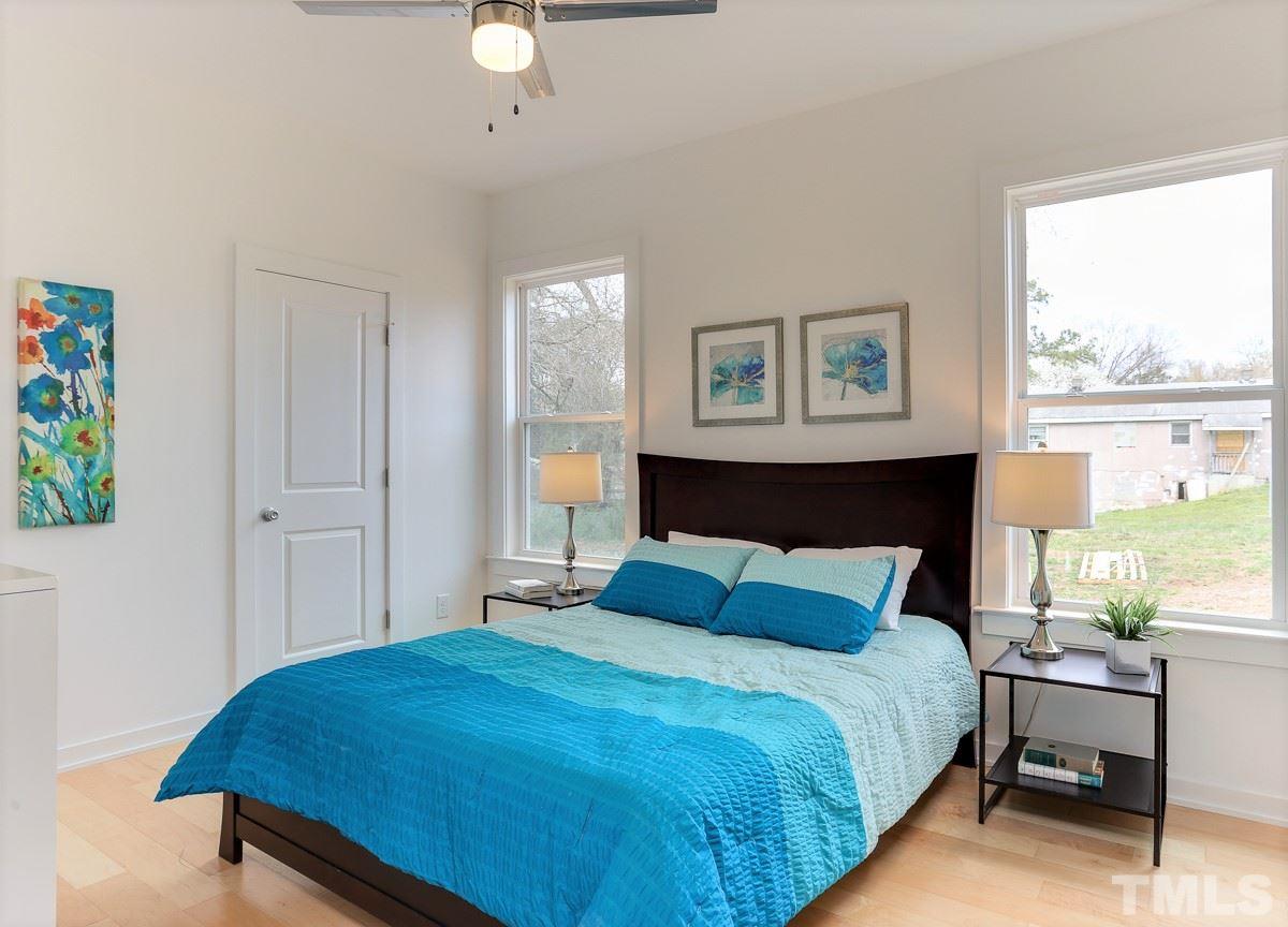 1310 South East Street Raleigh, NC 27601 - Photo 18 of 21 a bedroom with a bed and a window