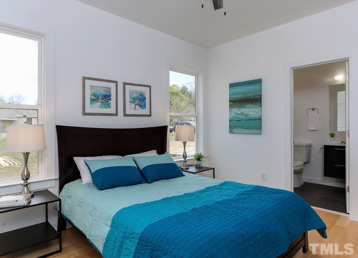1310 South East Street Raleigh, NC 27601 - Photo 19 of 21 a bedroom with bed and window