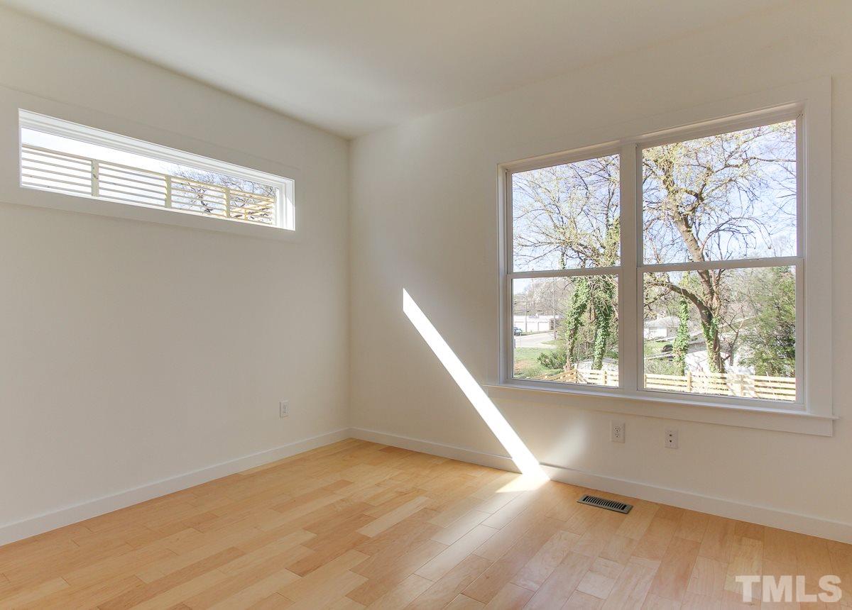 1310 South East Street Raleigh, NC 27601 - Photo 8 of 21 a view of an empty room with a window