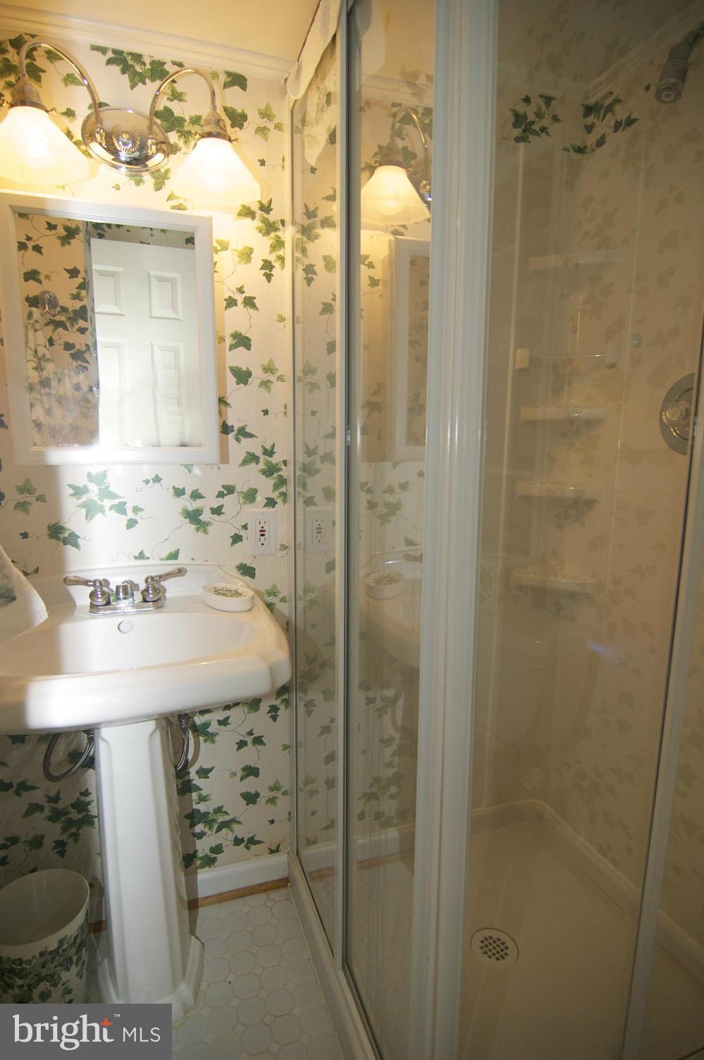 10701 Margate Road Silver Spring, MD 20901 - Photo 22 of 30 White ceramic tile FULL BATH IN BSMT