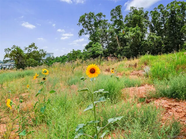 an aerial view of a house with yard swimming pool and outdoor seating