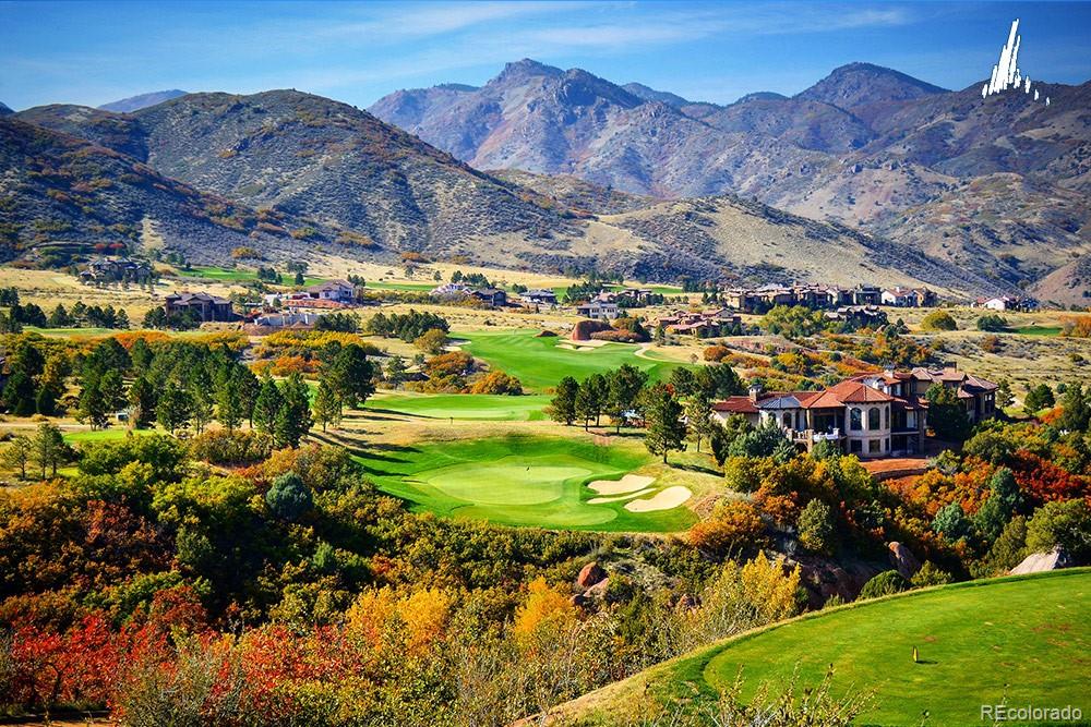 7983 Raphael Lane Littleton, CO 80125 - Photo 22 of 26 a view of a town with mountains in the background