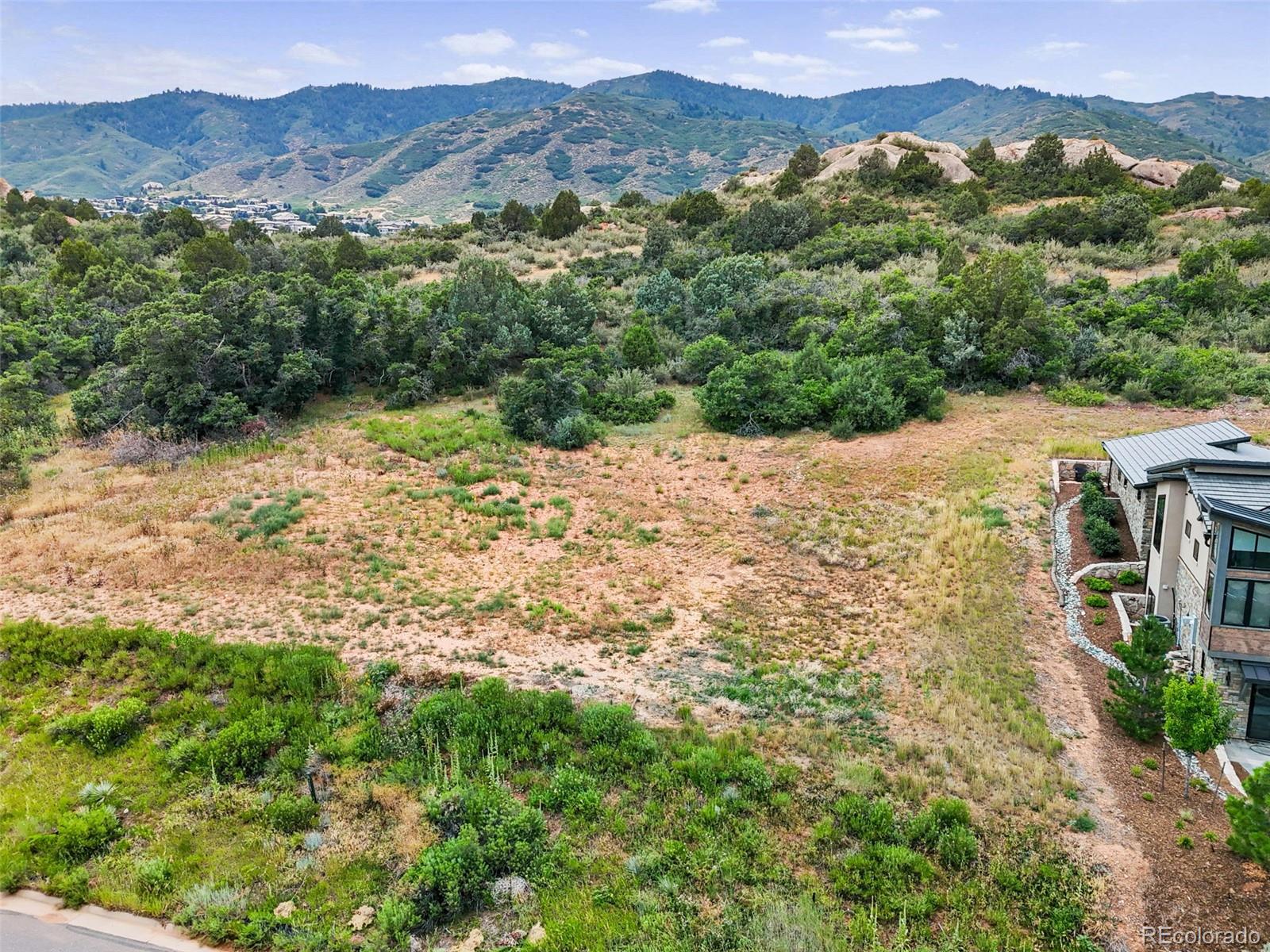 7983 Raphael Lane Littleton, CO 80125 - Photo 6 of 26 a view of a mountain with a forest
