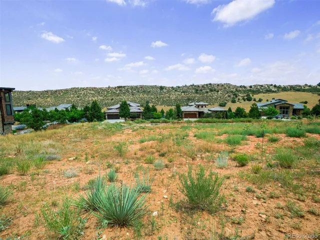 a view of a lake with a yard