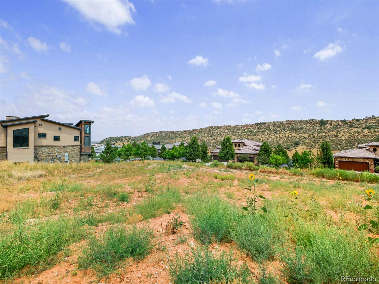 7983 Raphael Lane Littleton, CO 80125 - Photo 10 of 26 a view of a house with a yard