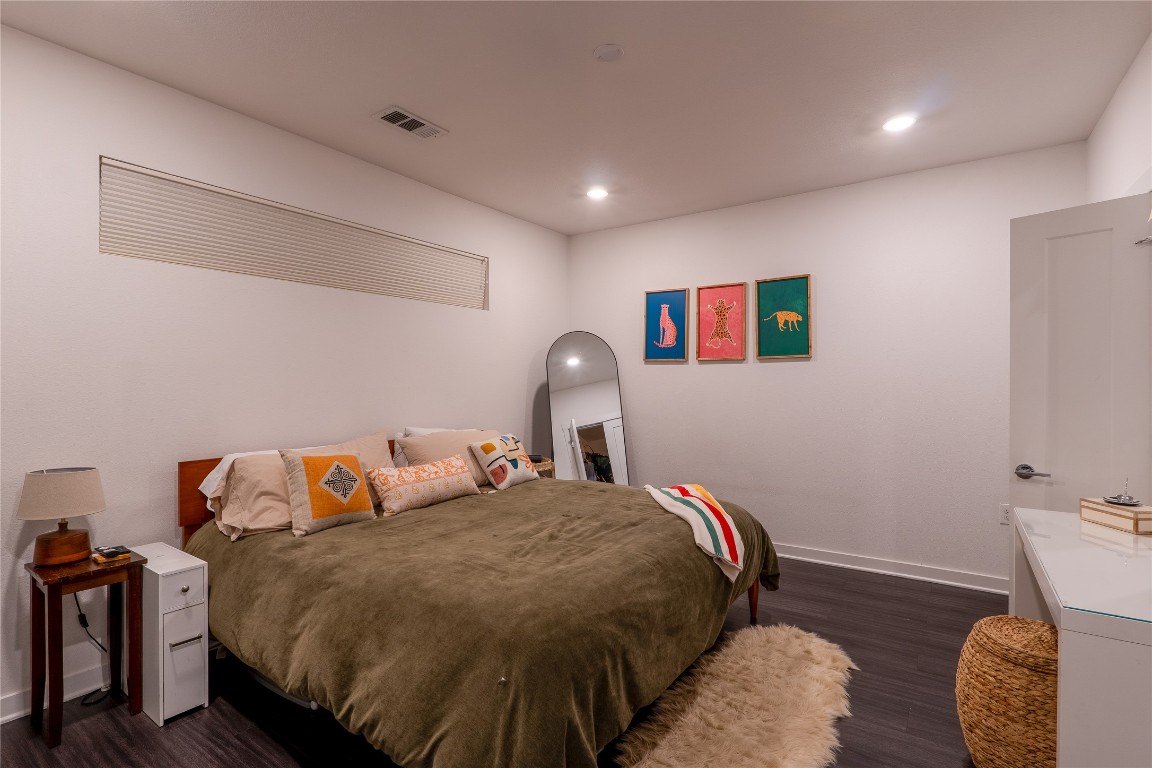 4361 South Congress Avenue, Unit 314 Austin, TX 78745 - Photo 10 of 25 a bedroom with a bed and a painting on the wall