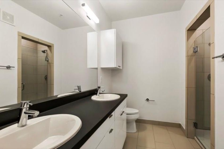 4361 South Congress Avenue, Unit 314 Austin, TX 78745 - Photo 13 of 25 a bathroom with a sink and a mirror