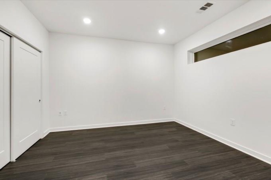 4361 South Congress Avenue, Unit 314 Austin, TX 78745 - Photo 16 of 25 a view of a room with wooden floor