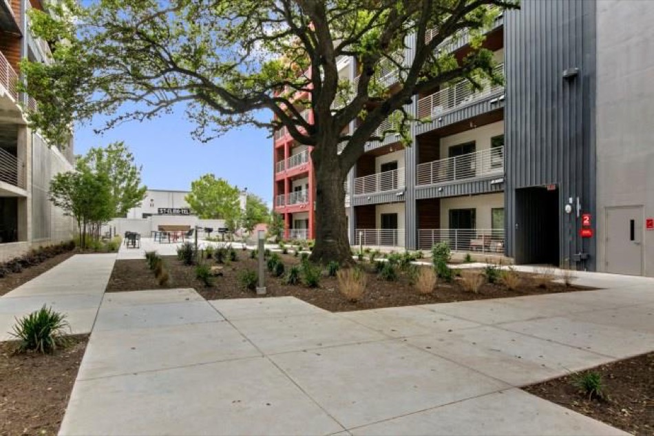 4361 South Congress Avenue, Unit 314 Austin, TX 78745 - Photo 22 of 25 a front view of a building with garden