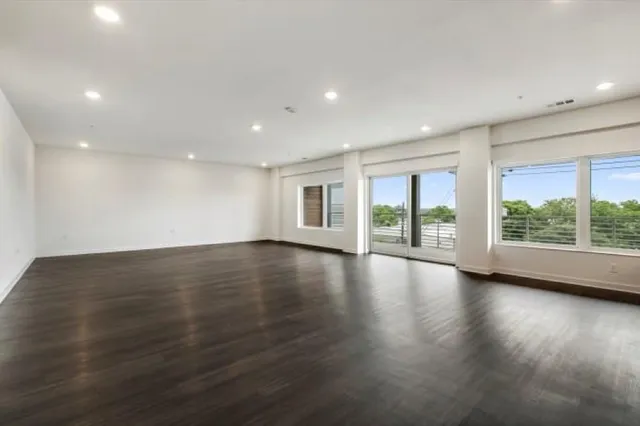 a view of kitchen with sink microwave and stove