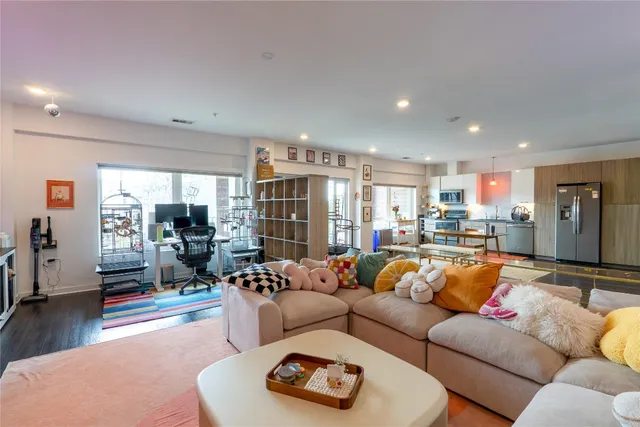 a view of kitchen with a refrigerator and a stove top oven
