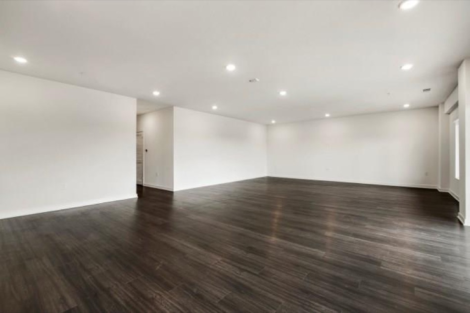 4361 South Congress Avenue, Unit 314 Austin, TX 78745 - Photo 8 of 25 a view of an empty room with wooden floor