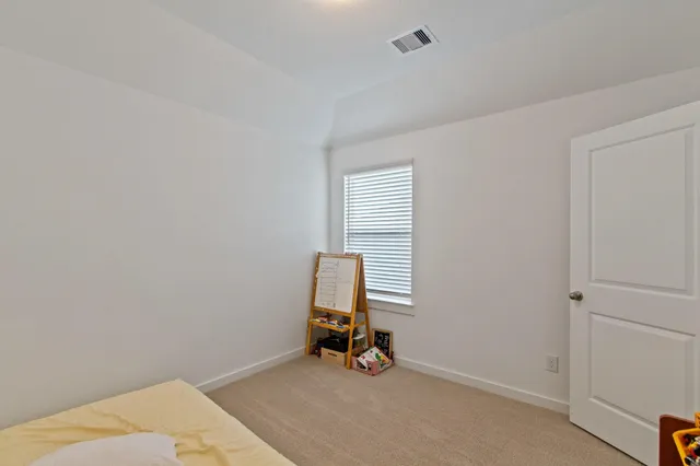 a room with a window and gym equipment