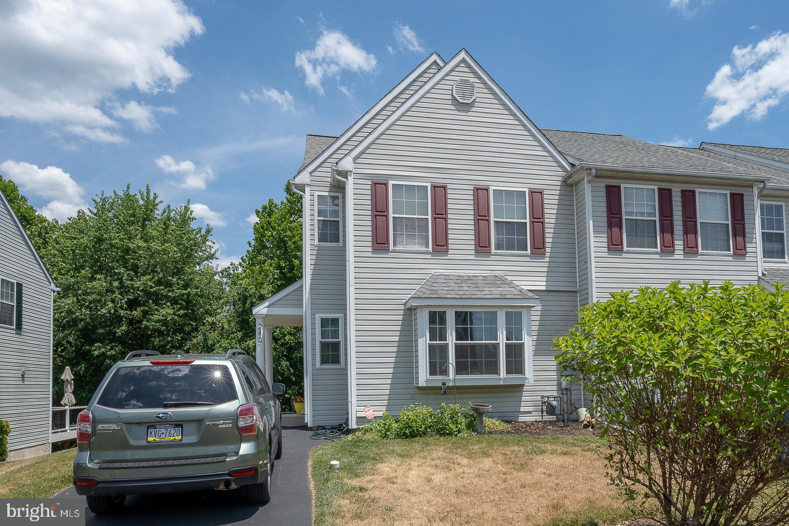 a front view of a house with parking space