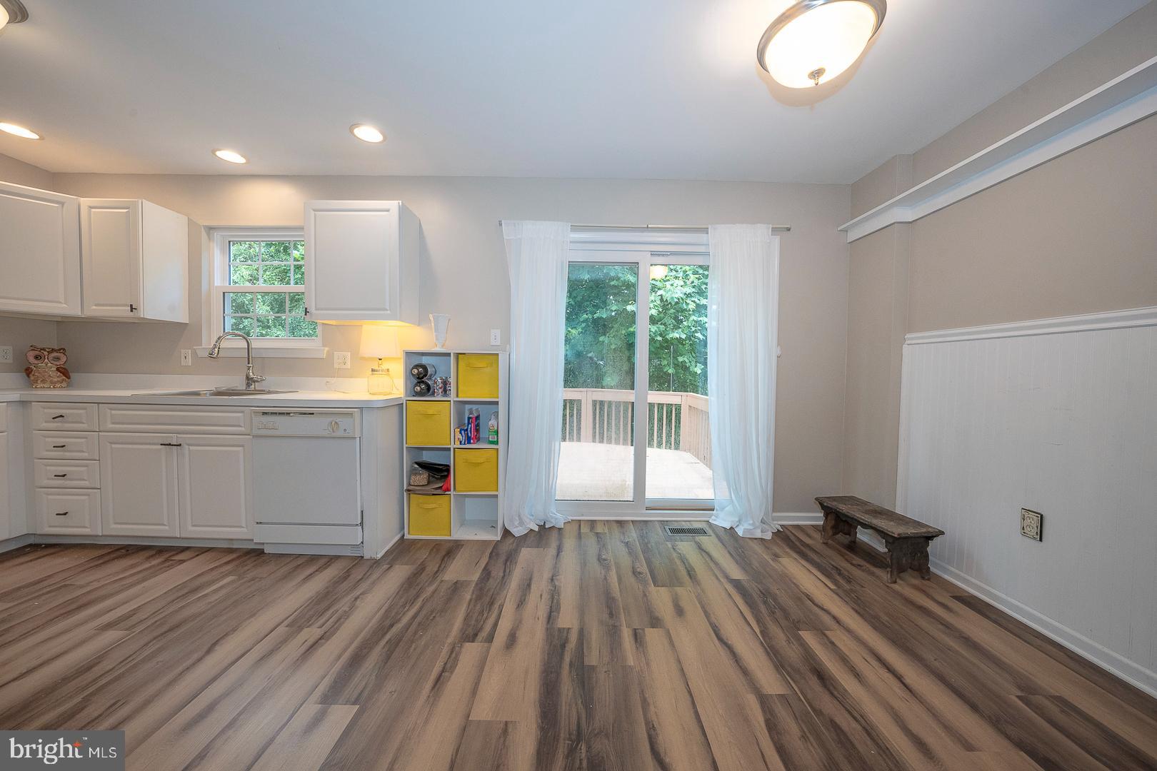 240 Springvalley Way Aston, PA 19014 - Photo 12 of 29 a view of a kitchen with wooden floor and electronic appliances